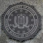 FBI seal mounted on a granite wall