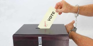 Foreigners Busted Voting For PRESIDENT. They Weren’t The Only ONES Hand in handcuffs casting a vote into a ballot box