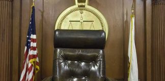 judge's chair in a wooden courtroom