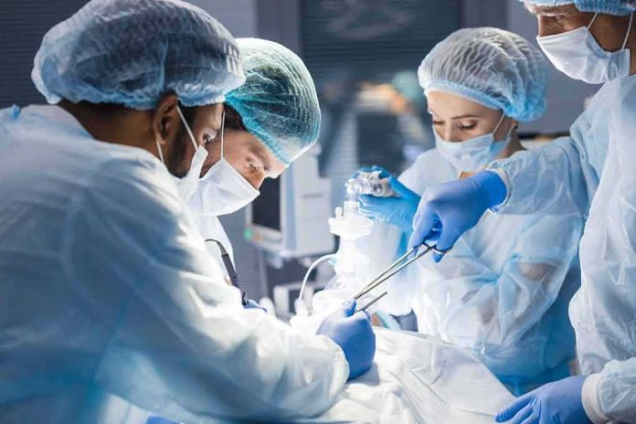 shutterstock_1265400856 surgeons performing an operation