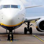 Passenger jet parked on tarmac front view