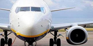 Passenger jet parked on tarmac front view