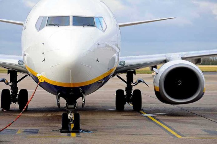 Passenger jet parked on tarmac front view