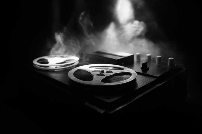 Reel-to-reel tape recorder in moody smoke-lit scene