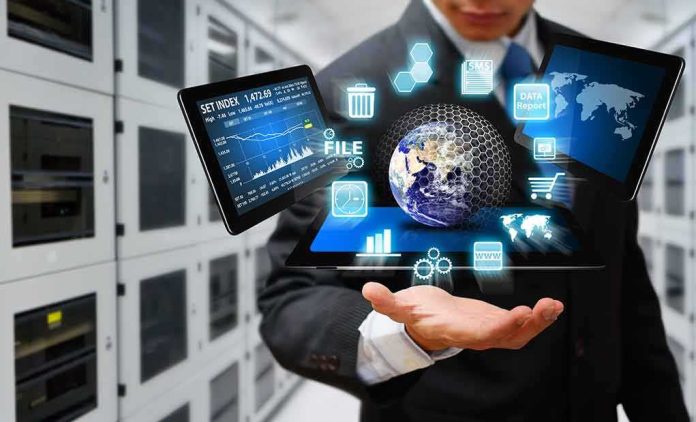 Businessperson holding a digital tablet with floating data icons