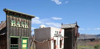 Wild West themed bank and jail buildings in a desert setting