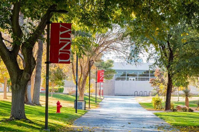 Tree-lined campus walkway with red banners