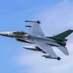 Fighter jet banking in the sky