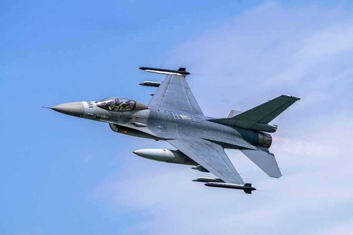 shutterstock_1629356173 Fighter jet banking in the sky