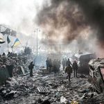 A chaotic protest scene with smoke, fire, and people holding flags