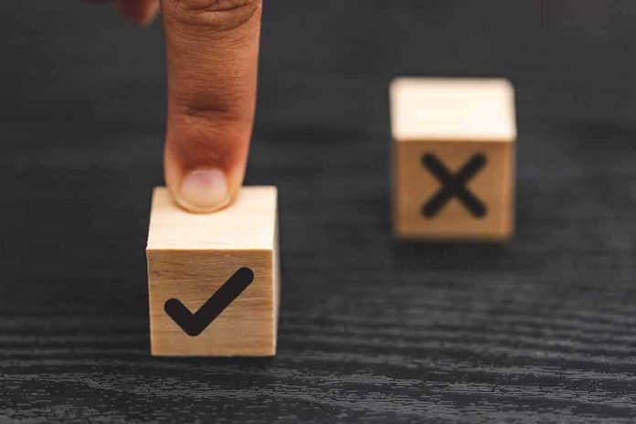 finger pressing wooden block with check mark