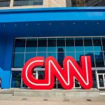 He Was WRONG — CNN’S STAR Walks Back ON-AIR! CNN logo sculpture outside a modern glass building