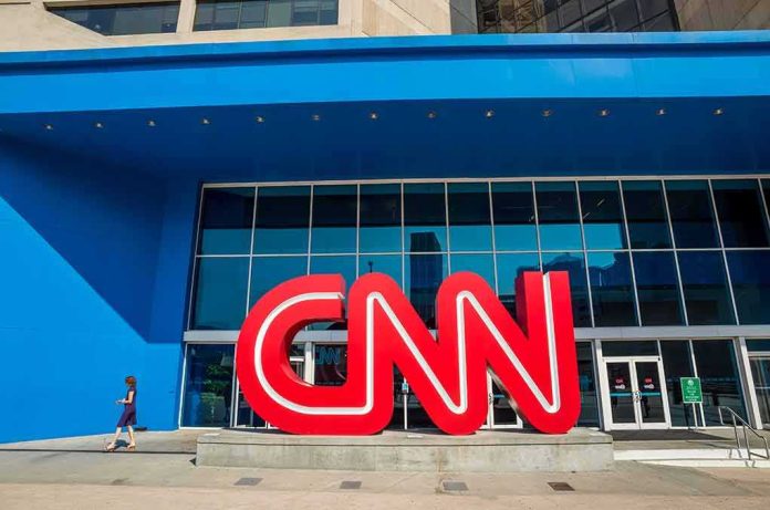 CNN logo sculpture outside a modern glass building