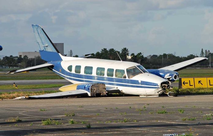 shutterstock_2445734 Damaged blue and white small airplane on an airport runway