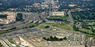 Aerial view of a large five-sided government building with surrounding highways