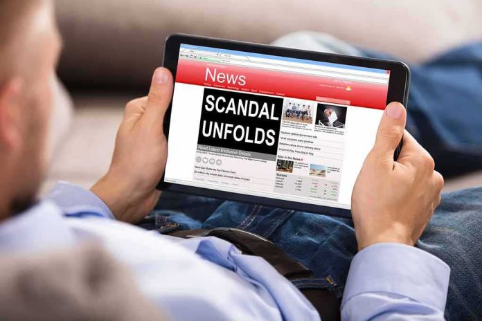 shutterstock_686343781 Person holding a tablet showing a news website