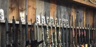 Congress Could ERASE Your Gun WIN With One Small Move rack of rifles and shotguns in a gun store