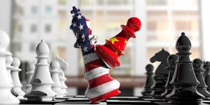 Chess pieces with US and China flag designs colliding on a board