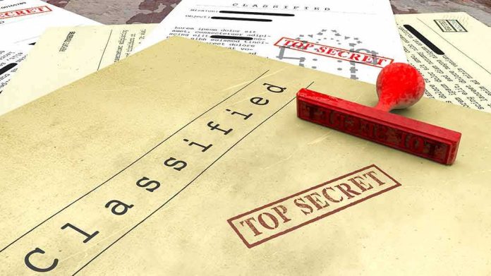 Classified documents with red Top Secret stamp and rubber stamp