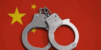 Handcuffs on red background with yellow stars