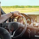 102,000 Pickups RECALLED — Yours May Be LYING To You Driver's hands on steering wheel of car interior
