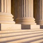 Marble columns with sunlight and shadow on steps
