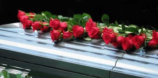 TV Preacher DEAD At 86 — What He SOLD His Own Flock For $1,000 Red roses on a closed silver casket