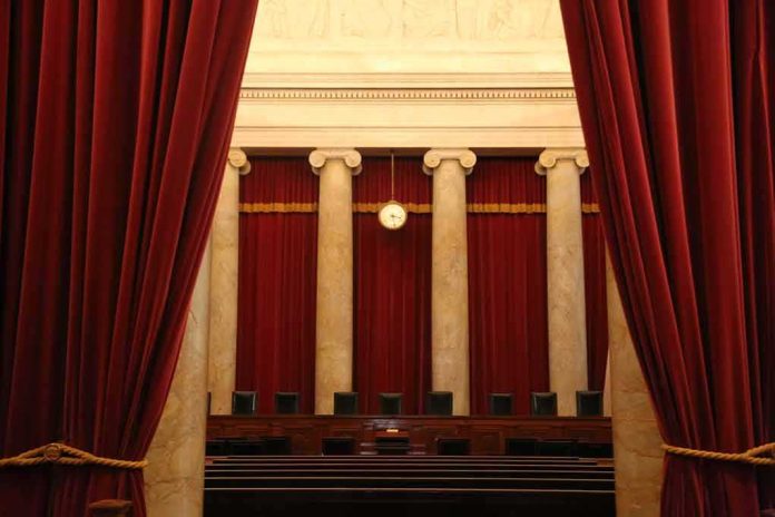 Courtroom with red curtains and marble columns