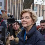 Elizabeth Warren speaking to reporters outdoors