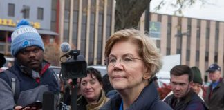 Elizabeth Warren speaking to reporters outdoors