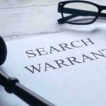 Feds DIGGING Into How Omar Got Here — And Who ELSE Search warrant document with gavel, glasses, and pen on desk