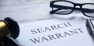 Feds DIGGING Into How Omar Got Here — And Who ELSE Search warrant document with gavel, glasses, and pen on desk
