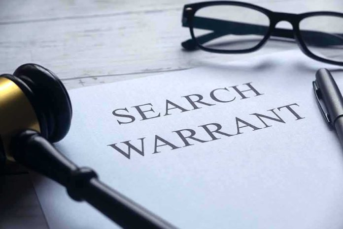 Search warrant document with gavel, glasses, and pen on desk