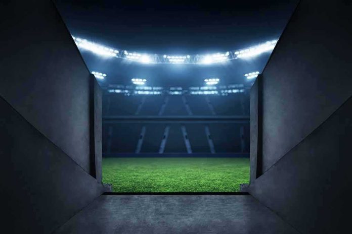 Stadium tunnel opening onto a brightly lit field
