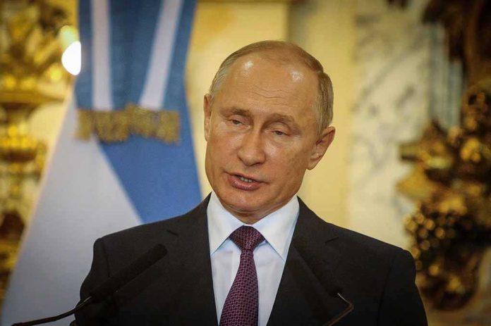 shutterstock_2189842447 Vladimir Putin speaking at a podium with microphones
