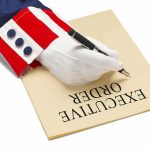 Trump’s EO to Kill CRUSHING Mortgage Fees Uncle Sam costume sleeve signing a document with a pen